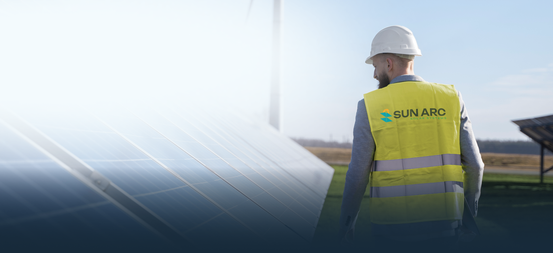 Sun Arc Solar engineer inspecting solar panels